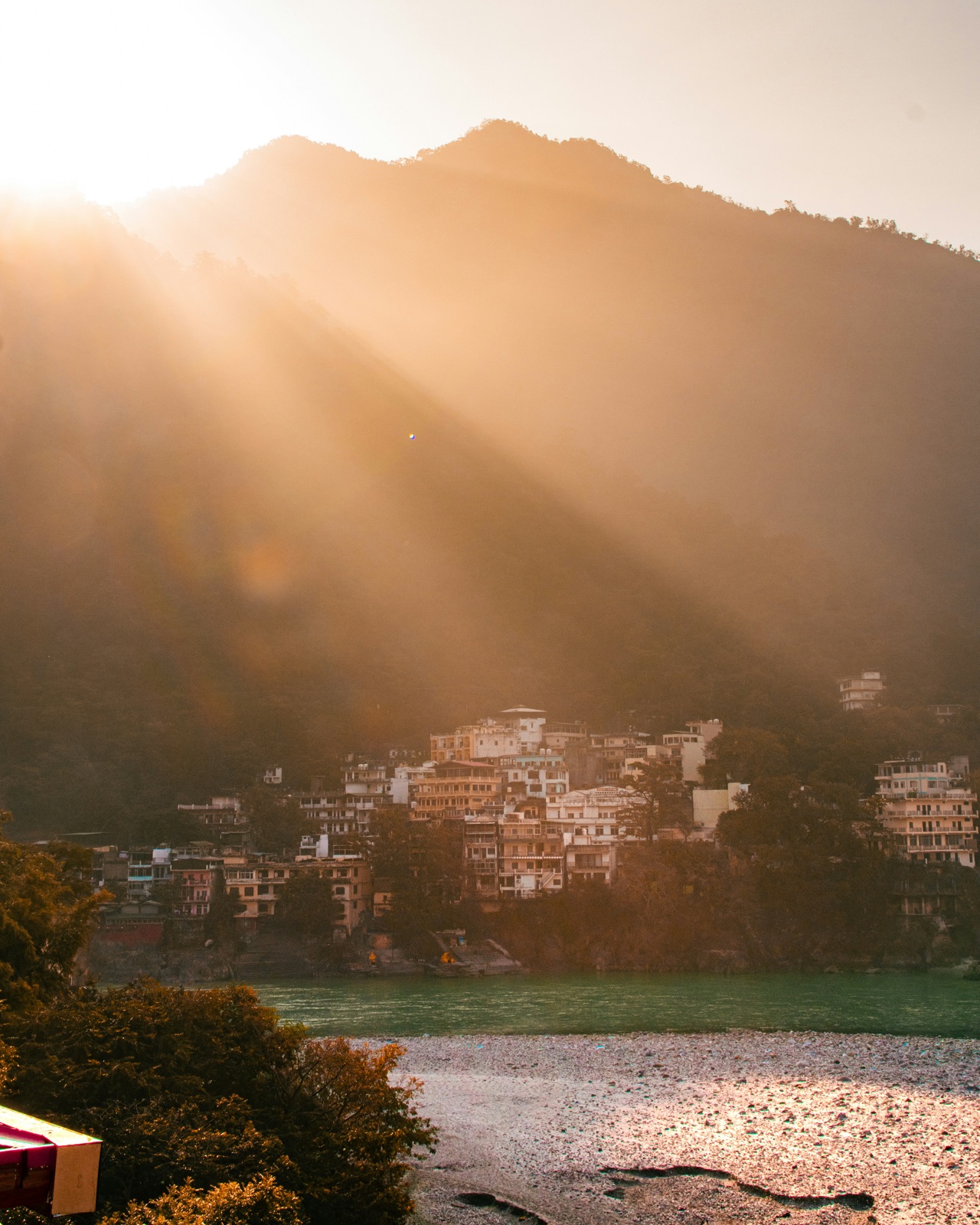 Sunrise light rays over the hills above Rishikesh